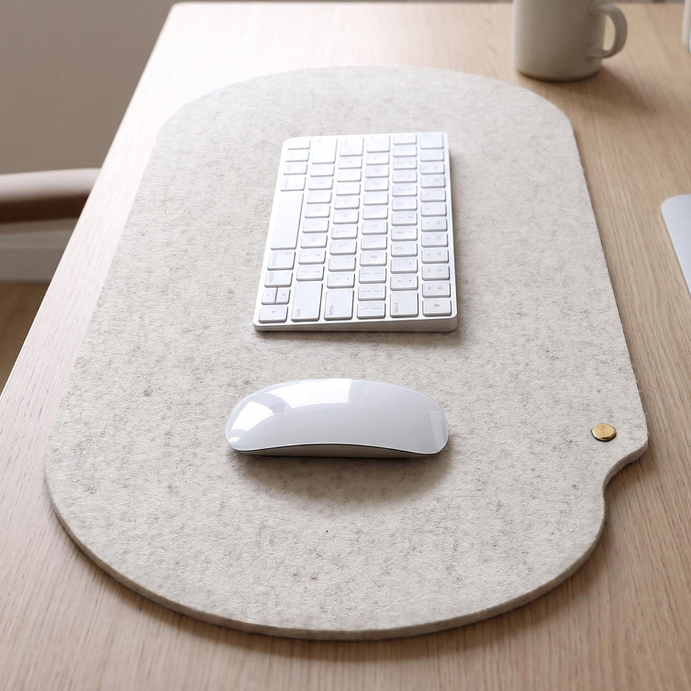 Raw white Merino wool felt desk mat with keyboard and mouse